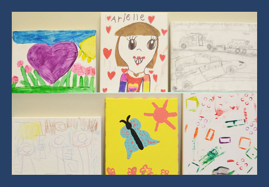 The image shows a collection of colorful children s artwork displayed on a white surface with various drawings featuring different subjects such as animals, vehicles, and nature scenes.